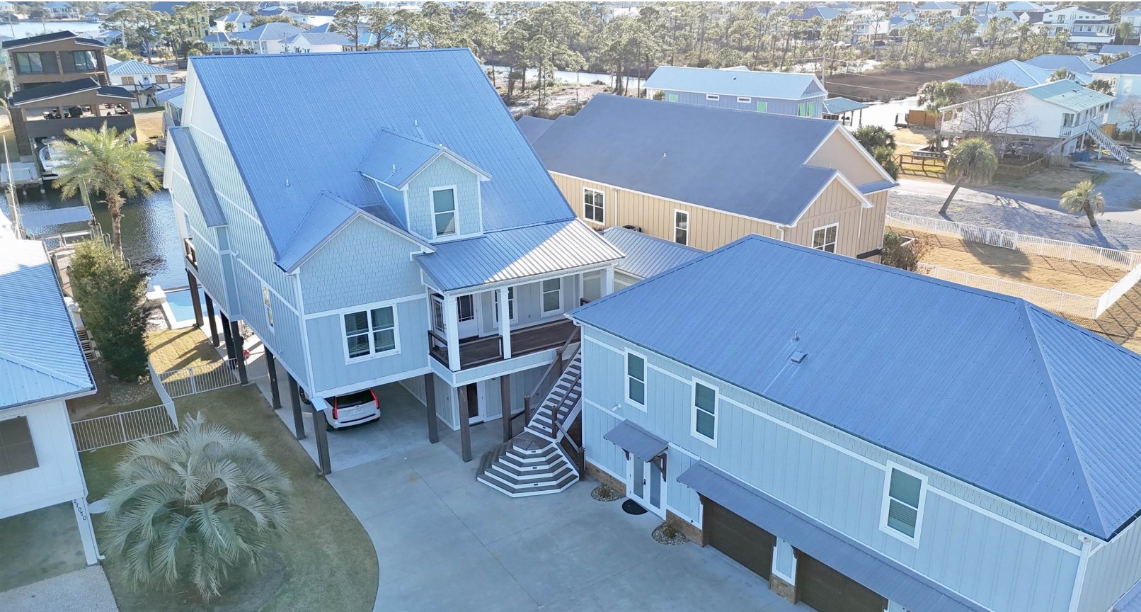 Waterfront home on Marina Road in Orange Beach, Alabama, with a covered boat lift on the canal.