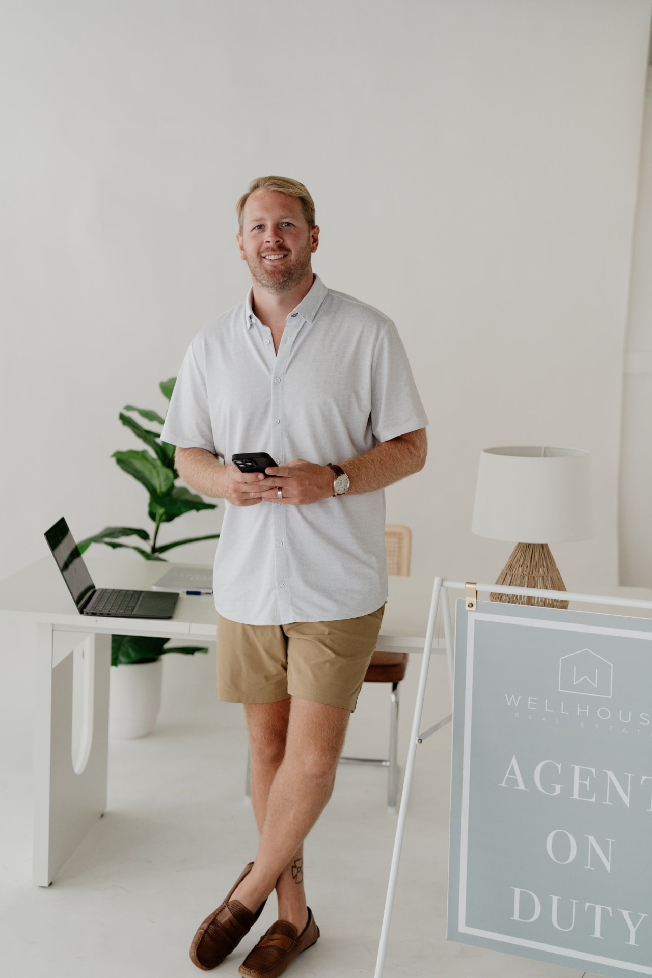 KD Edenfield standing in the Wellhouse Real Estate office